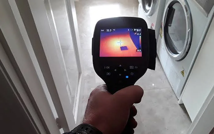 Thermal imaging camera showing a hidden water leak under a Yorba Linda laundry room floor